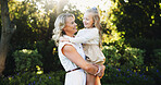 Outdoor, smile and mother with child for carrying, relationship and connection together in park. Happy family, mom and girl with love for bonding, caring and trust on weekend holiday in nature