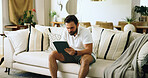 Home, typing and man on sofa, tablet and internet with online reading, serious and investment. Apartment, tech and person on couch, connection and tax report with digital app for savings and trading