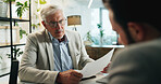 Businessman, executive and meeting with documents for corporate proposal, budget or investment at office. Man, CEO or financial advisor talking to client with paperwork for company funding or finance