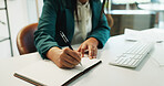 Business person, hands and writing with book at office desk for reminder, schedule planning or agenda. Closeup, employee or planner taking notes with ideas in notebook or diary for tasks at workplace
