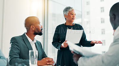 Buy stock photo Meeting, mature businesswoman and talking with document in office, investment pitch and feedback. Boardroom, employees and finance manager with portfolio for budget, review report and presentation