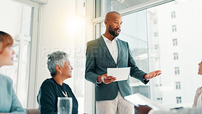 Buy stock photo Meeting, planning and presentation with business man in office for review, quarterly profit margin and sales update. Portfolio shareholder, investor feedback and account advisor with employees