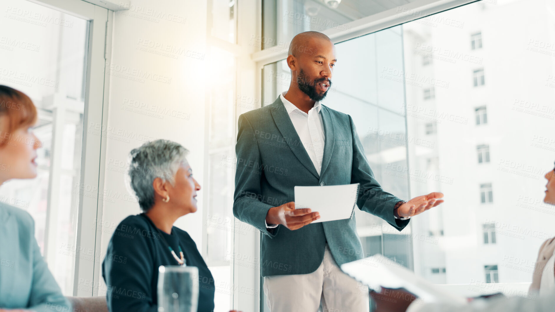 Buy stock photo Meeting, planning and presentation with business man in office for review, quarterly profit margin and sales update. Portfolio shareholder, investor feedback and account advisor with employees