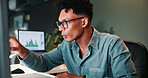 Man, reading and computer for trading in office of statistics review, finance charts and stock market graph. Person, pointing and information for exchange, financial increase and investment pattern