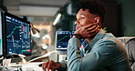 Man, tired and computer screen with trading, stats and review for revenue report in office at company. Person, typing and monitor at night, graphs or research with price for stock market at agency