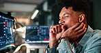 Man, yawn and tired by computer screen for trading, charts or review for revenue report in office at company. Person, typing and monitor at night, graphs and burnout with stock market stats at agency