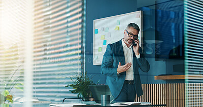 Buy stock photo Phone call, serious and mature man in office, accountant or talking to contact for tax or discussion. Business, auditor and person with mobile for communication, financial or conversation for funding