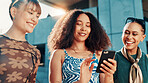 City, friends and laughing with smartphone for joke, funny communication and comment with fashion. Urban, group and happy women with mobile application for chat, social media and cool style for gen z
