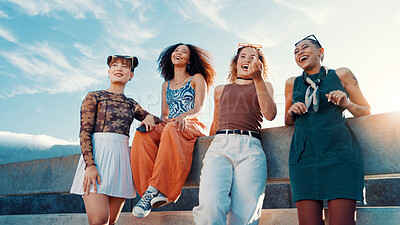 Buy stock photo Low angle, fashion and friends laughing in city on bridge in cool clothes, casual outfit or modern style. Relax, talking or trendy women with smile in urban town for holiday, streetwear or vacation