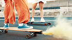 People, skateboard and smoke on road in city for travel, fun activity and attention hobby. Legs, friends and transport equipment with flame signal as warning, speed torch and bonding together outdoor