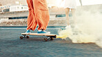 Skateboard, smoke and shoes with friends in city for gen z youth, streetwear fashion and balance. Fitness, energy and travel with people skating in street for riding, hobby and action together
