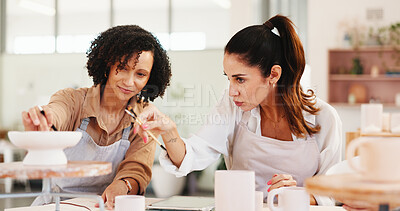 Buy stock photo Pottery, art class and women with clay in workshop for teaching, learning and skills development. Creative, studio and teacher with practice for ceramic design, sculpture and DIY hobby in lesson