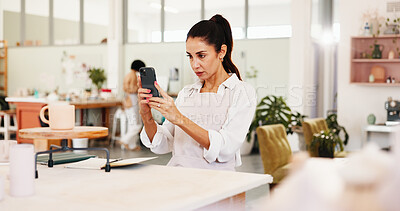 Buy stock photo Pottery class, phone and woman in ceramic workshop with online post, achievement and clay product. Picture, social media and person in studio with support, feedback and sculpture design or hobby mold