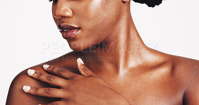 Buy stock photo Shoulder, skincare and touch with black woman in studio for body care, hydration and beauty routine. Shine, glow and dermatology with closeup of person on white background for cosmetics and collagen 