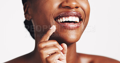 Buy stock photo Beauty, lip scrub and smile with black woman in studio for exfoliation, spa glow and skincare. Cosmetics, sugar treatment and dermatology with closeup of person on white background for self care