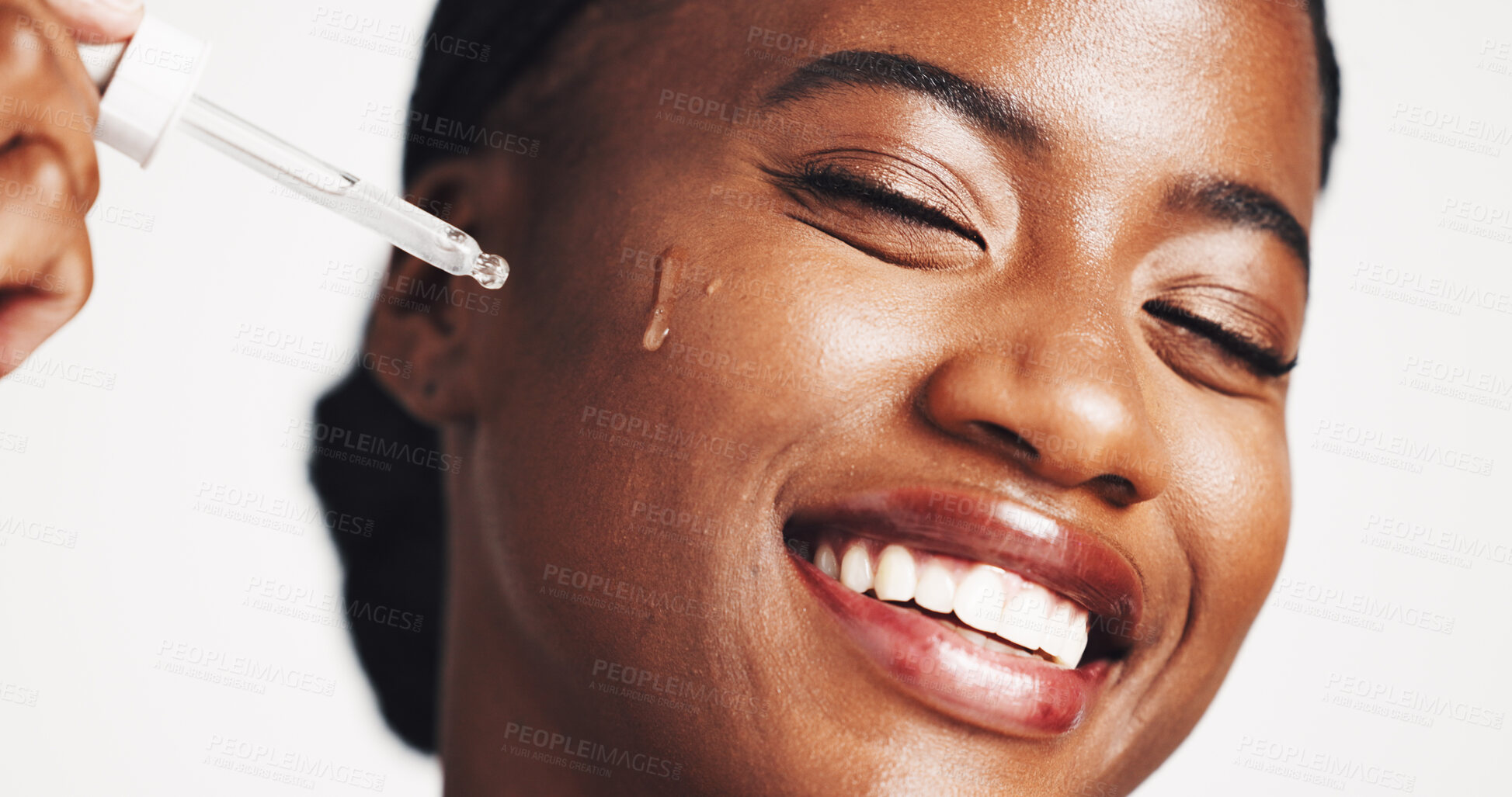 Buy stock photo Skincare, serum and woman with product, smile and moisturizing of face with liquid, hydration and studio. White background, happy and black person with cosmetics for treatment, glow and smooth skin