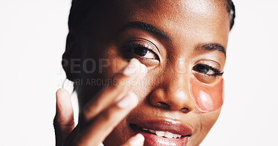Buy stock photo Portrait, skincare and eye patches with black woman in studio for dermatology, self care and spa treatment. Glow, collagen mask and beauty with person on white background for shine and facial