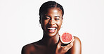 Happy, black woman and portrait with grapefruit for detox, vitamin C or skincare on a white studio background. Female person, model or smile with natural organic fruit for facial treatment on space