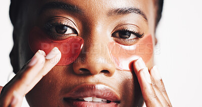 Buy stock photo Black woman, portrait and eye patches with mask or hydration on a white studio background. Face, female person or model with facial gel or cosmetics for collagen, dermatology or anti aging treatment