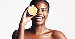 Happy, black woman and portrait with lemon for skincare, detox or vitamin C on a white studio background. Female person, model or smile with citrus fruit for natural organic treatment on mockup space