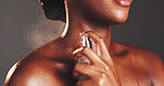 Hands, perfume and spray neck in studio for fragrance with product, liquid and test by background. Person, signature scent and skin with bottle, mist and luxury with essence with parfum for smell