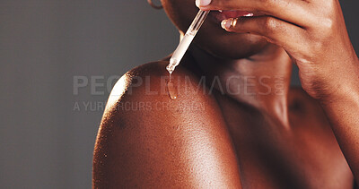 Buy stock photo Skincare, serum and woman with product, hands and moisturizing of skin with liquid, hydration and studio. Gray background, dermatology and person with cosmetics for treatment, glow and smooth body