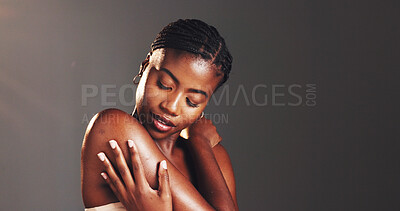 Buy stock photo Shoulder, skincare and shine with black woman in studio for body care, hydration and beauty routine. Space, glow and dermatology with person on dark background for cosmetics, touch and collagen