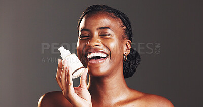 Buy stock photo Black woman, skincare and cream in portrait, studio and bottle for dermatology by background. African person, girl and product with lotion for beauty, glow or cosmetics with laughing in Nigeria