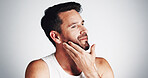 Thinking, beauty and man with beard in studio for wellness, grooming and haircare on white background. Happy, space and person touch for facial hair styling, growth and shave for morning routine