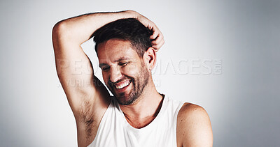 Buy stock photo Happy, man and smell of underarm, studio or sniffing of deodorant for hygiene, laughing or routine. White background, space and person with smile for scent, self care or grooming of armpit in morning