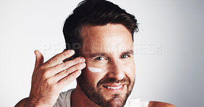 Buy stock photo Face cream, portrait and happy man with beauty in studio for anti aging, dermatology space or collagen. Apply, wrinkle treatment or mature person on white background for cosmetics or skincare lotion
