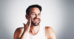 Apply, portrait and happy man with face cream for skincare space, moisturiser or collagen. Smile, wrinkle treatment or male person on white background in studio for cosmetics, beauty or facial lotion