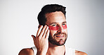 Smile, skincare and eye mask with man in studio for dermatology, self care and anti aging treatment. Glow, collagen patch and beauty with mature person on white background for shine and facial
