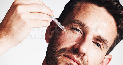 Buy stock photo Serum, beauty and portrait with man in studio for skincare, anti aging benefit and hydration. Collagen, shine and oil dropper with mature person on white background for cosmetics and self care