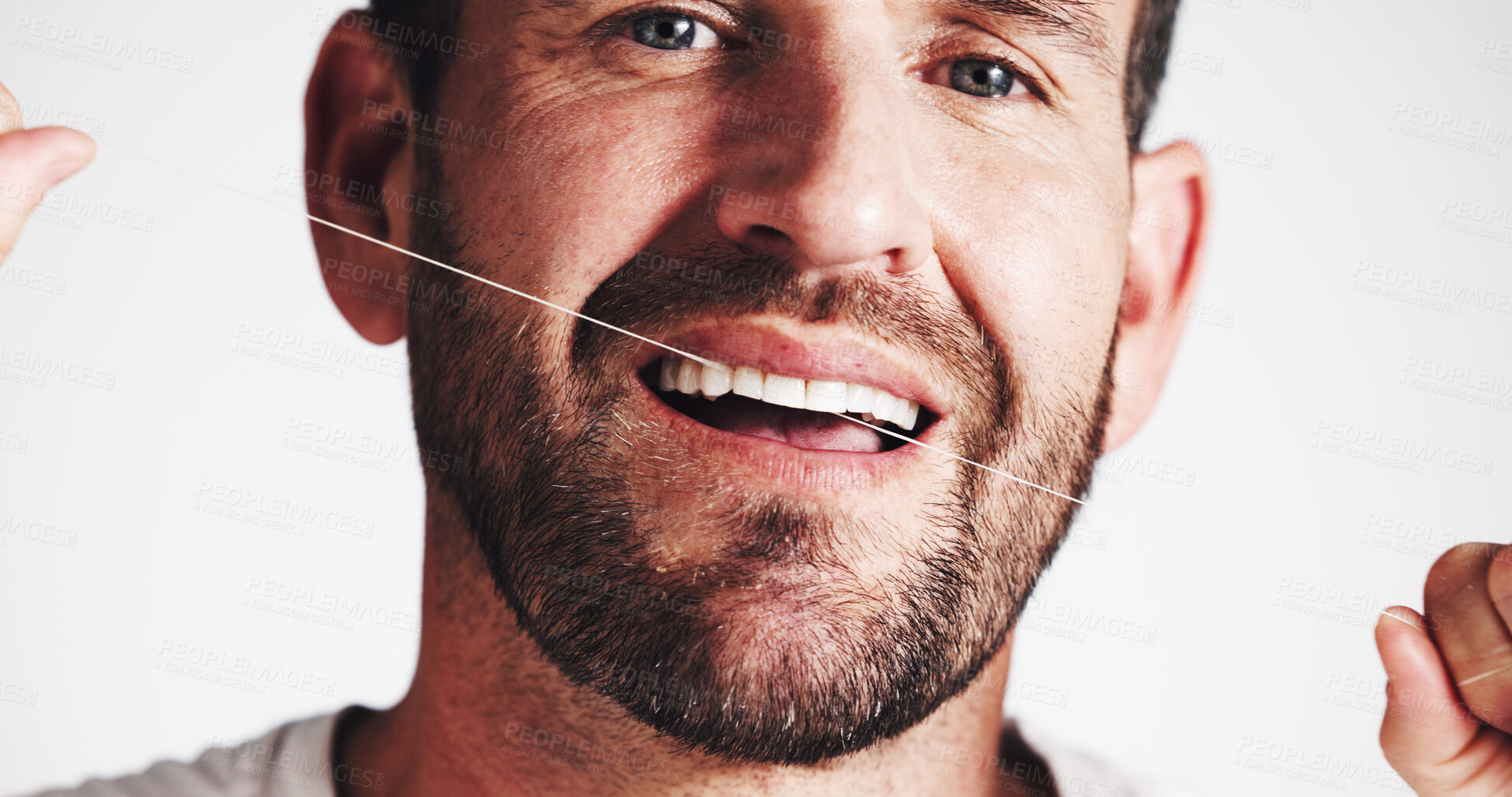 Buy stock photo Dental health, studio and man floss teeth for oral hygiene, gum wellness or self care on white background. Cleaning tooth, string and portrait with morning routine, plaque removal and fresh breath