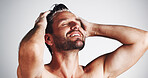 Shampoo, hair care and cleaning with man in studio for shower, scalp health and dandruff treatment. Growth, texture and grooming with person on white background for cosmetics, shine and beauty