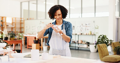 Buy stock photo Woman, ceramics and sculpture with thinking at workshop for shape, quality assurance and color for clay product. Person, design and smile with manufacturing process, results and inspection at studio