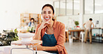 Woman, portrait and smile at pottery workshop with pride for career with sculpture, artist and job at studio. Person, happy and talent for craft with design, product and creativity at ceramic store