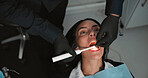 Hands, medical and mouth of patient with dentist in office for checkup, operation or surgery. Appointment, healthcare or oral exam with medicine professional and woman at clinic for dental hygiene