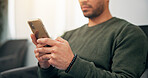 Man, hands and typing with phone in waiting room for dentist appointment, schedule or app at clinic. Closeup, male person or user with mobile smartphone for telehealth, connection or online review