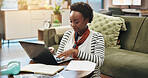 Laptop, typing and black woman in home for hybrid work, finance and accounting on internet. Computer, reading and freelancer writing report for audit, payroll information and bookkeeping with taxes