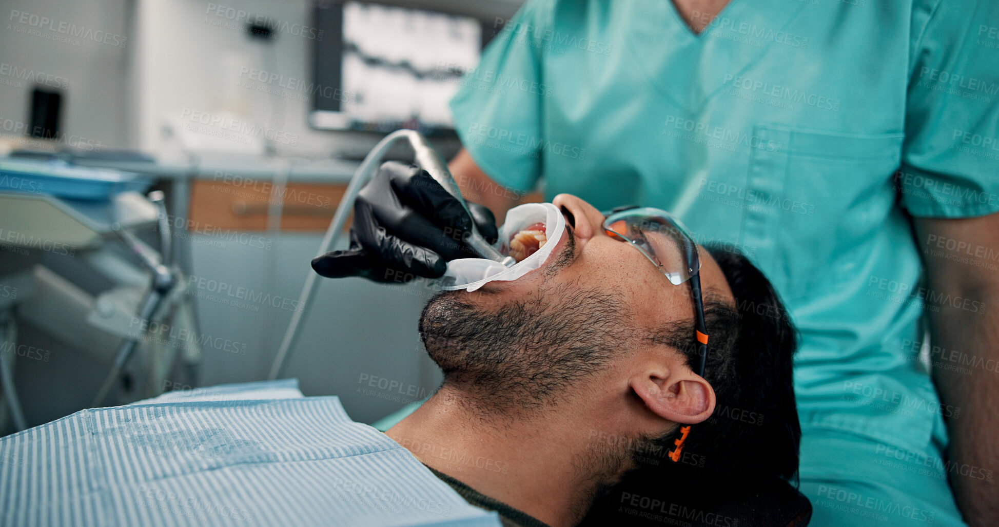 Buy stock photo Hand, treatment or patient with doctor in dental clinic for checkup, veneers or medical appointment. Man, open mouth or cleaning in oral exam for dentistry, teeth whitening or cosmetics consultation