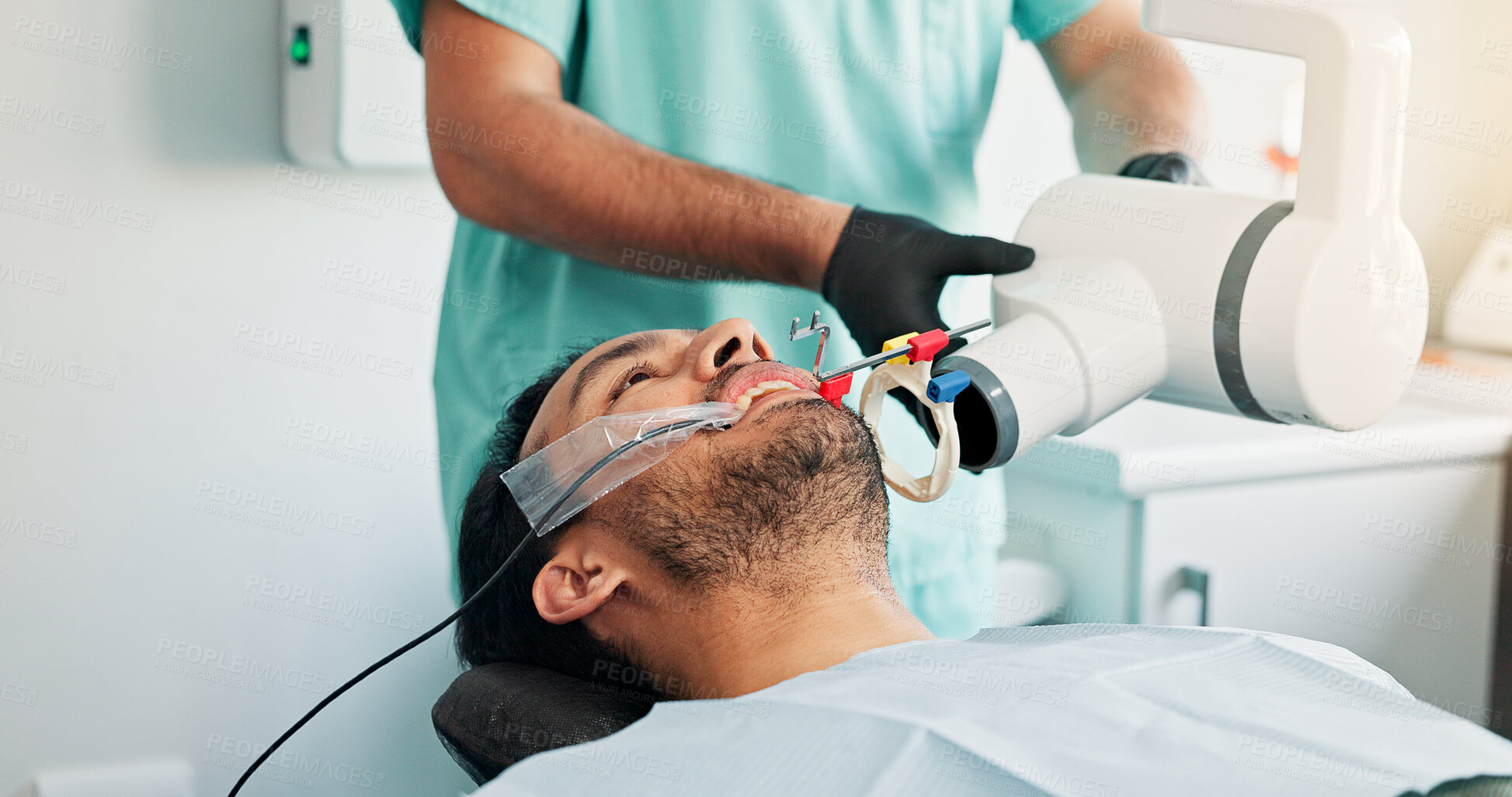 Buy stock photo Appointment, consulting or x ray with dentist and patient in office for assessment or checkup. Equipment, healthcare and mouth of man in clinic with dental professional for exam or oral scanning