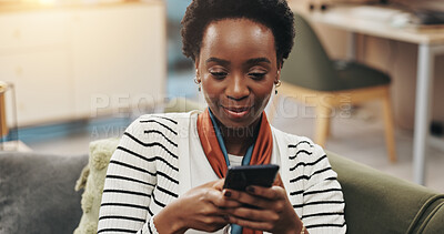 Buy stock photo Black woman, happy and typing with phone on sofa for text message, dating site and social media scroll. Relax, person and internet connection in home for streaming service, reading ebook and research