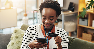Buy stock photo Home, credit card and black woman on sofa, smartphone and online shopping with banking app. African person, mobile user and cellphone with debit transactions, smile and payment with checkout or relax