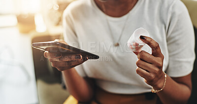 Buy stock photo Woman, hands and medication with phone for prescription, telehealth or medical research at home. Closeup, female person or patient with pills on mobile smartphone for dosage, side effects or symptoms