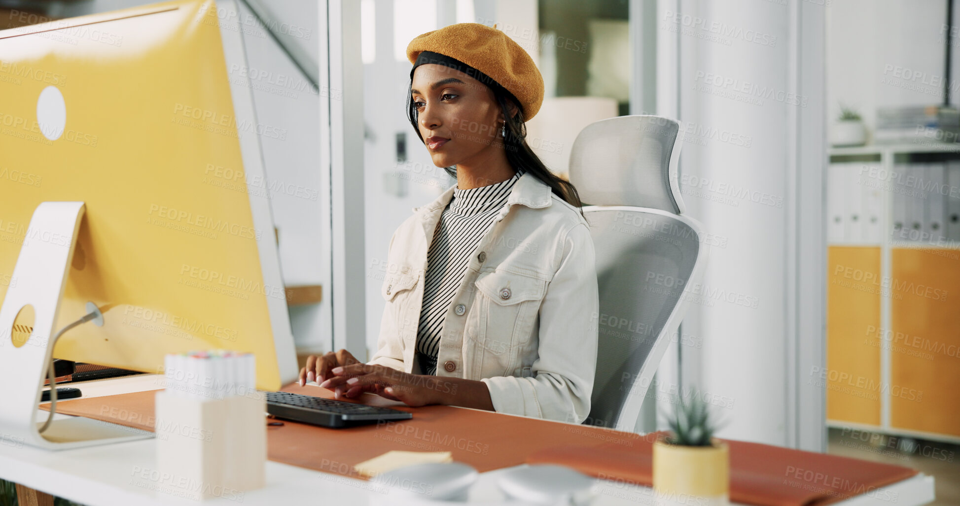 Buy stock photo Intern, designer or Indian woman on computer in startup for artistic project, digital media or video editing. Creative, typing or research for content creation, post production or filmmaking software