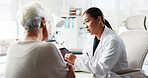 Tablet, doctor and conversation with patient for healthcare report, test results or help. Medical professional, tech and consultation with senior woman for checkup, questions or symptoms in hospital