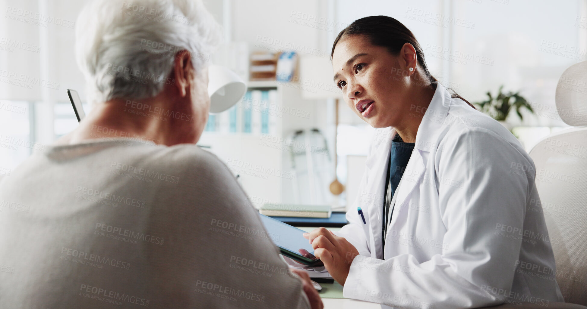 Buy stock photo Tablet, doctor and talking to patient for healthcare report, test results and help. Medical professional, tech and consultation with elderly woman for checkup or questions for symptoms in hospital