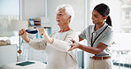 Physiotherapy, stretching and woman with mature patient for medical service, support and wellness. Healthcare, chiropractor and physical therapist with person for consulting, rehabilitation and help